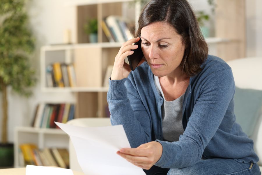 woman calling her insurance about termite control